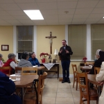 Father Eduardo speaking to the sisters