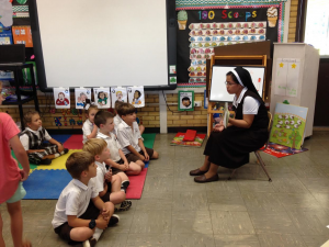 Sr. Cristilyn reading to students